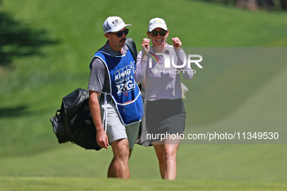 Sarah Schmelzel of the United States interacts with her caddy on the 18th hole during Day Two of the KPMG Women's PGA Championship at Sahale...