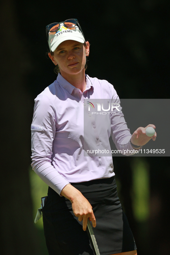 Sarah Schmelzel of the United States acknowledges the gallery after her birdie on the 18th green during Day Two of the KPMG Women's PGA Cham...