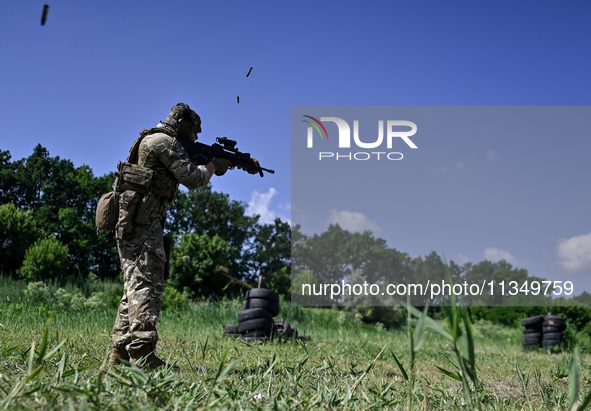 A soldier of a reconnaissance unit of the 128th separate mountain assault brigade of the Zakarpattia region is partaking in a fire training...