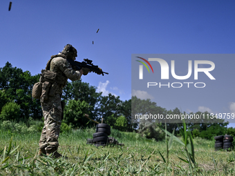 A soldier of a reconnaissance unit of the 128th separate mountain assault brigade of the Zakarpattia region is partaking in a fire training...