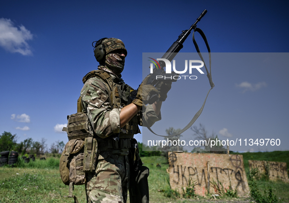 A soldier of a reconnaissance unit of the 128th separate mountain assault brigade of the Zakarpattia region is partaking in a fire training...