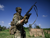 A soldier of a reconnaissance unit of the 128th separate mountain assault brigade of the Zakarpattia region is partaking in a fire training...