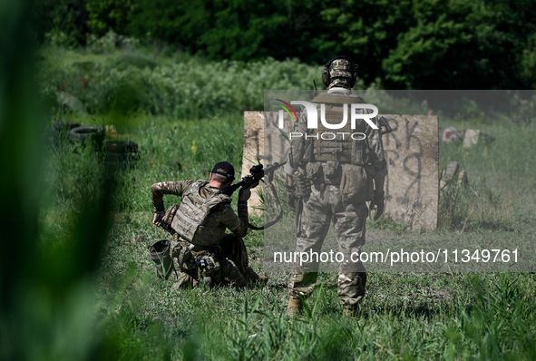 A combat squad of a reconnaissance unit of the 128th separate mountain assault brigade of the Zakarpattia region is being seen before the st...