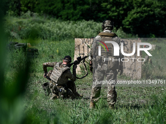 A combat squad of a reconnaissance unit of the 128th separate mountain assault brigade of the Zakarpattia region is being seen before the st...