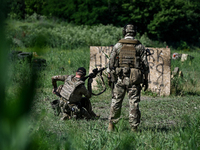 A combat squad of a reconnaissance unit of the 128th separate mountain assault brigade of the Zakarpattia region is being seen before the st...