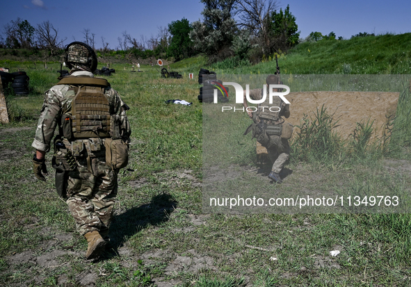 A combat squad of a reconnaissance unit of the 128th separate mountain assault brigade of the Zakarpattia region is being seen before the st...