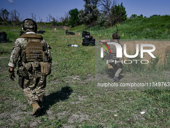 A combat squad of a reconnaissance unit of the 128th separate mountain assault brigade of the Zakarpattia region is being seen before the st...