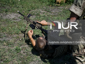 A combat squad of a reconnaissance unit of the 128th separate mountain assault brigade of the Zakarpattia region is being seen before the st...