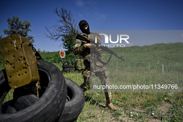 A soldier of a reconnaissance unit of the 128th separate mountain assault brigade of the Zakarpattia region is partaking in a fire training...