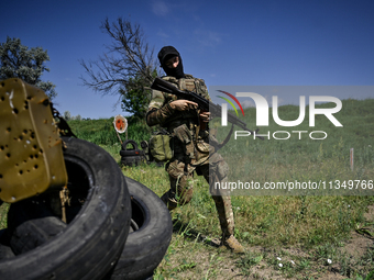 A soldier of a reconnaissance unit of the 128th separate mountain assault brigade of the Zakarpattia region is partaking in a fire training...