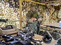 A soldier of a reconnaissance unit of the 128th separate mountain assault brigade of the Zakarpattia region is preparing for a firearms trai...