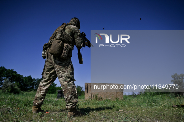 A soldier of a reconnaissance unit of the 128th separate mountain assault brigade of the Zakarpattia region is partaking in a fire training...