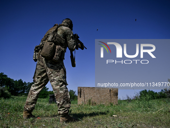 A soldier of a reconnaissance unit of the 128th separate mountain assault brigade of the Zakarpattia region is partaking in a fire training...