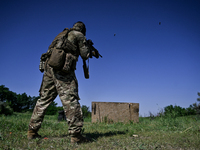 A soldier of a reconnaissance unit of the 128th separate mountain assault brigade of the Zakarpattia region is partaking in a fire training...