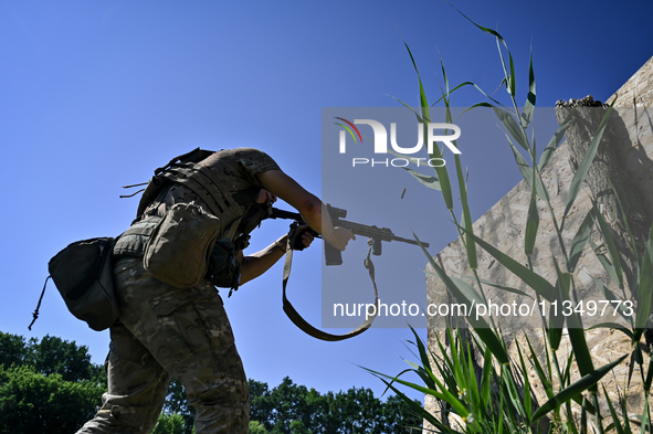 A soldier of a reconnaissance unit of the 128th separate mountain assault brigade of the Zakarpattia region is partaking in a fire training...