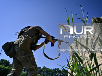 A soldier of a reconnaissance unit of the 128th separate mountain assault brigade of the Zakarpattia region is partaking in a fire training...