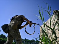 A soldier of a reconnaissance unit of the 128th separate mountain assault brigade of the Zakarpattia region is partaking in a fire training...