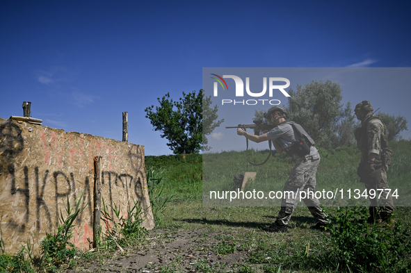 A combat squad of a reconnaissance unit of the 128th separate mountain assault brigade of the Zakarpattia region is being seen before the st...