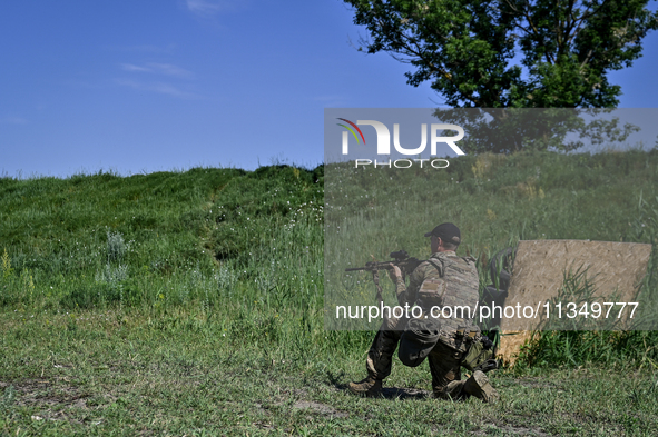 A soldier of a reconnaissance unit of the 128th separate mountain assault brigade of the Zakarpattia region is partaking in a fire training...