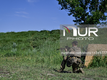 A soldier of a reconnaissance unit of the 128th separate mountain assault brigade of the Zakarpattia region is partaking in a fire training...