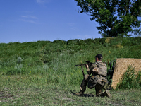 A soldier of a reconnaissance unit of the 128th separate mountain assault brigade of the Zakarpattia region is partaking in a fire training...