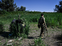 A soldier of a reconnaissance unit of the 128th separate mountain assault brigade of the Zakarpattia region is partaking in a fire training...