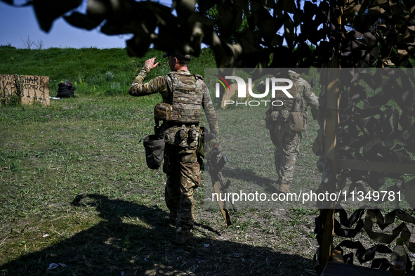 A combat squad of a reconnaissance unit of the 128th separate mountain assault brigade of the Zakarpattia region is being seen before the st...