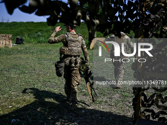 A combat squad of a reconnaissance unit of the 128th separate mountain assault brigade of the Zakarpattia region is being seen before the st...