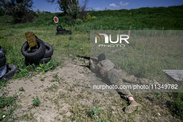 A soldier of a reconnaissance unit of the 128th separate mountain assault brigade of the Zakarpattia region is partaking in a fire training...