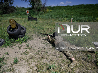 A soldier of a reconnaissance unit of the 128th separate mountain assault brigade of the Zakarpattia region is partaking in a fire training...