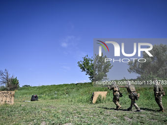 A soldier of a reconnaissance unit of the 128th separate mountain assault brigade of the Zakarpattia region is partaking in a fire training...