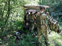 A combat squad of a reconnaissance unit of the 128th separate mountain assault brigade of the Zakarpattia region is being seen before the st...