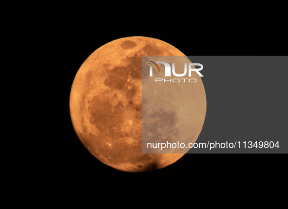 The Strawberry Moon is being seen in Ungaran, Central Java Province, Indonesia, on June 21, 2024. 