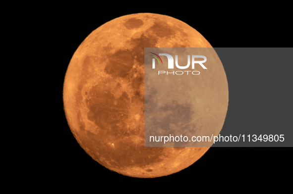 The Strawberry Moon is being seen in Ungaran, Central Java Province, Indonesia, on June 21, 2024. 