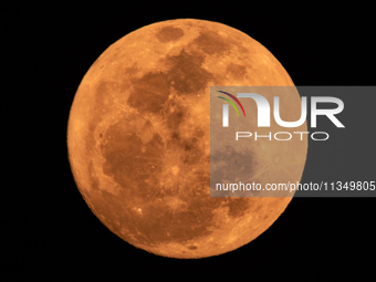 The Strawberry Moon is being seen in Ungaran, Central Java Province, Indonesia, on June 21, 2024. (