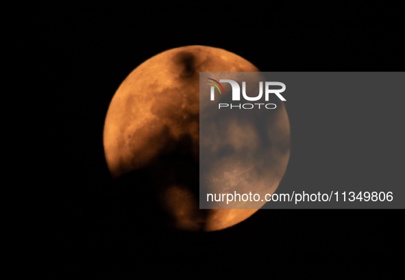 The Strawberry Moon is being seen in Ungaran, Central Java Province, Indonesia, on June 21, 2024. 