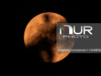 The Strawberry Moon is being seen in Ungaran, Central Java Province, Indonesia, on June 21, 2024. (