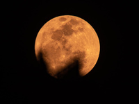 The Strawberry Moon is being seen in Ungaran, Central Java Province, Indonesia, on June 21, 2024. (