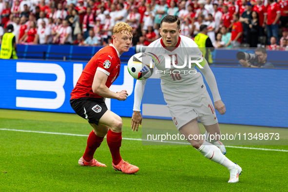 Nicolas Seiwald, Piotr Zielinski are playing during the UEFA Euro 2024 Group D match between Poland v Austria, at the Olympiastadion in Berl...