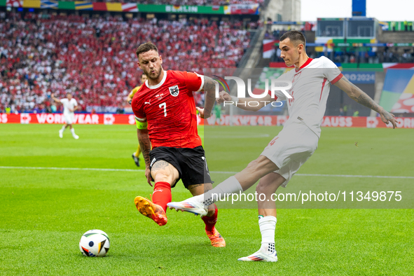 Marko Arnautovic, Jakub Kiwior are playing during the UEFA Euro 2024 Group D match between Poland v Austria, at the Olympiastadion in Berlin...