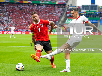 Marko Arnautovic, Jakub Kiwior are playing during the UEFA Euro 2024 Group D match between Poland v Austria, at the Olympiastadion in Berlin...