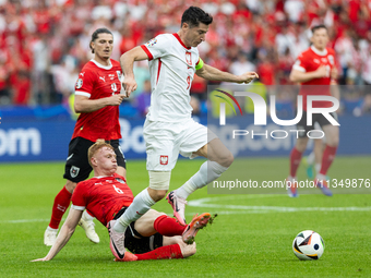 Nicolas Seiwald, Robert Lewandowski are playing during the UEFA Euro 2024 Group D match between Poland v Austria, at the Olympiastadion in B...