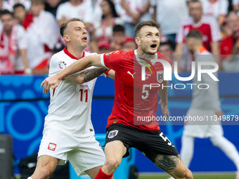 Kamil Grosicki, Stefan Posch are playing during the UEFA Euro 2024 Group D match between Poland v Austria, at the Olympiastadion in Berlin,G...