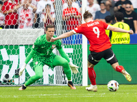 Wojciech Szczesny, Marcel Sabitzer  are playing during the UEFA Euro 2024 Group D match between Poland v Austria, at the Olympiastadion in B...