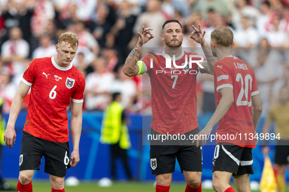 Nicolas Seiwald, Marko Arnautovic, Konrad Laimer  are playing during the UEFA Euro 2024 Group D match between Poland v Austria, at the Olymp...