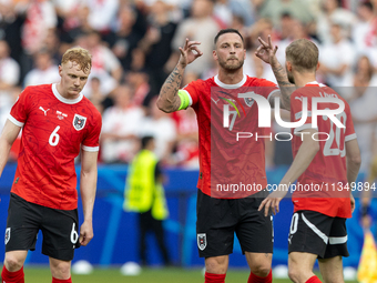 Nicolas Seiwald, Marko Arnautovic, Konrad Laimer  are playing during the UEFA Euro 2024 Group D match between Poland v Austria, at the Olymp...