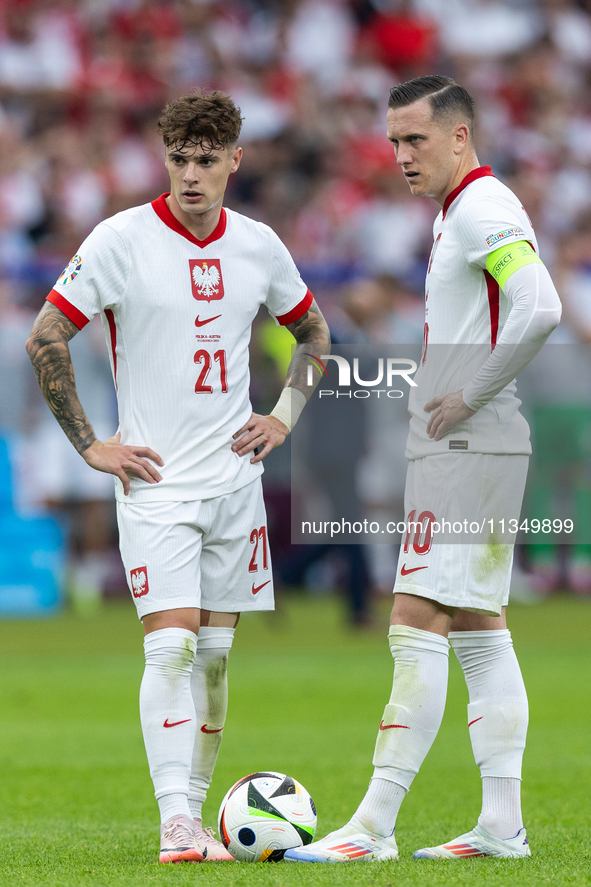 Nicola Zalewski, Piotr Zielinski  are playing during the UEFA Euro 2024 Group D match between Poland v Austria, at the Olympiastadion in Ber...