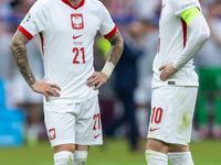 Nicola Zalewski, Piotr Zielinski  are playing during the UEFA Euro 2024 Group D match between Poland v Austria, at the Olympiastadion in Ber...