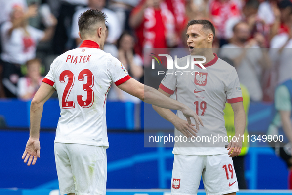 Krzysztof Piatek, Przemyslaw Frankowski  are playing during the UEFA Euro 2024 Group D match between Poland v Austria, at the Olympiastadion...