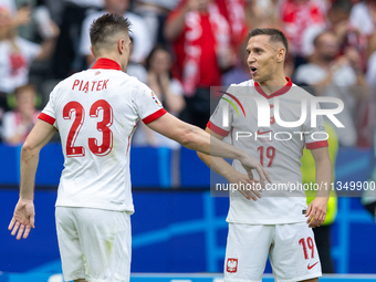 Krzysztof Piatek, Przemyslaw Frankowski  are playing during the UEFA Euro 2024 Group D match between Poland v Austria, at the Olympiastadion...